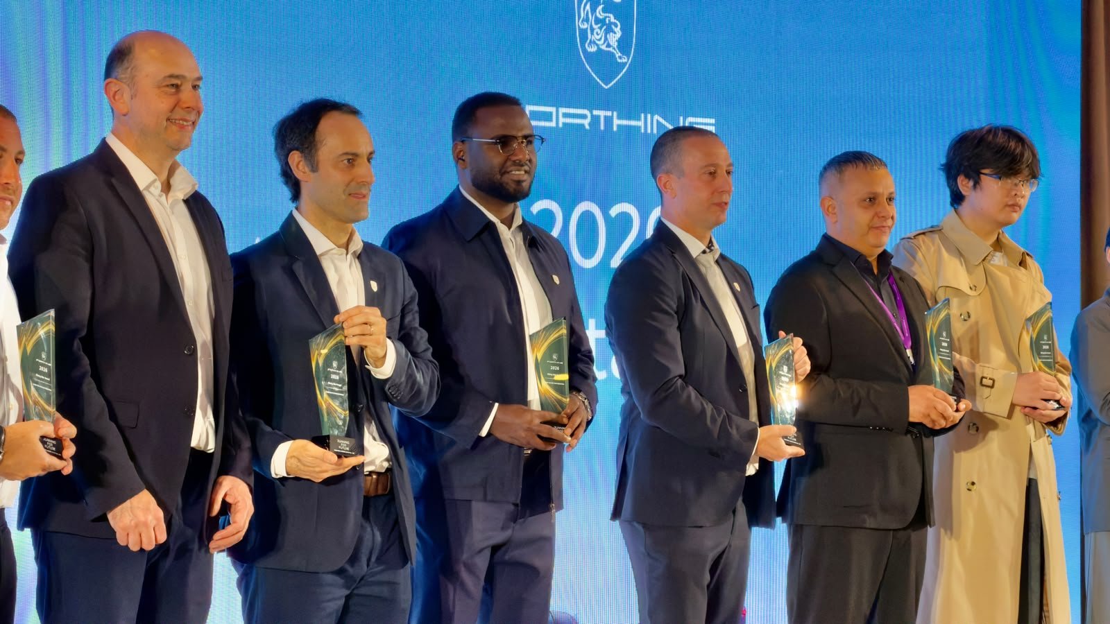 Jeeh Motors at the 2026 Paris Motor Show: Bringing FORTHING's Next Generation of Electric Mobility Closer to Ethiopia 6 FORTHING partners and executives on stage holding awards at the 2026 Paris Motor Show