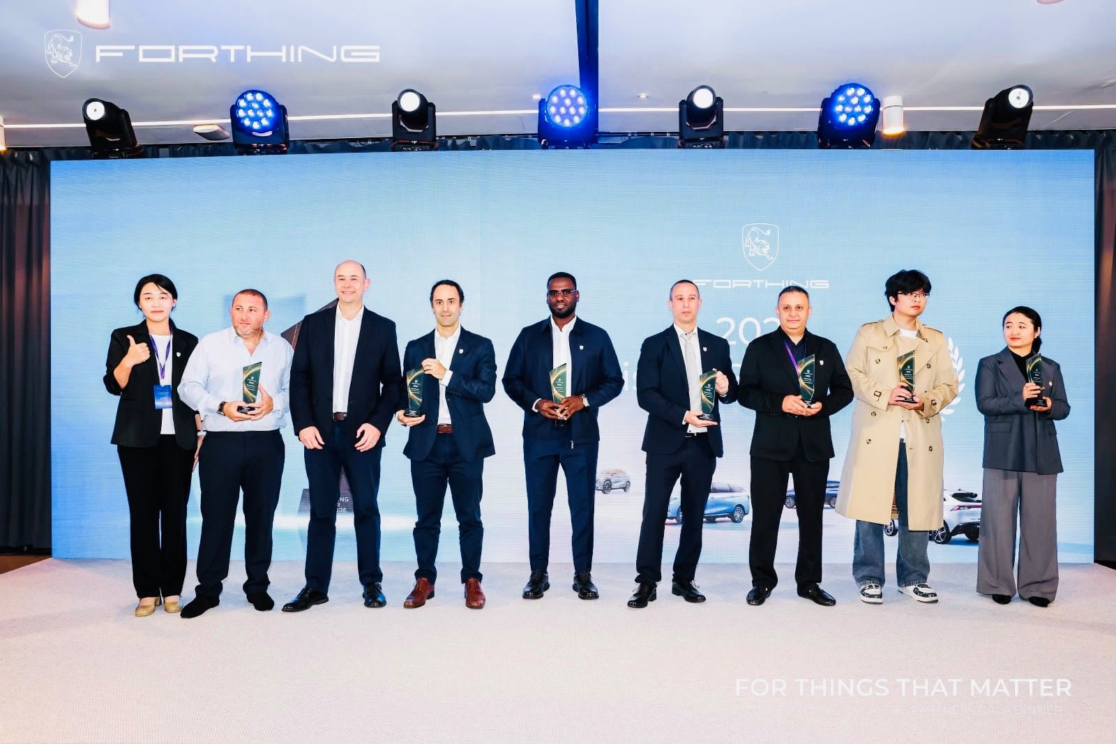 Jeeh Motors at the 2026 Paris Motor Show: Bringing FORTHING's Next Generation of Electric Mobility Closer to Ethiopia 8 FORTHING award recipients posing on stage at the 2026 Paris Motor Show