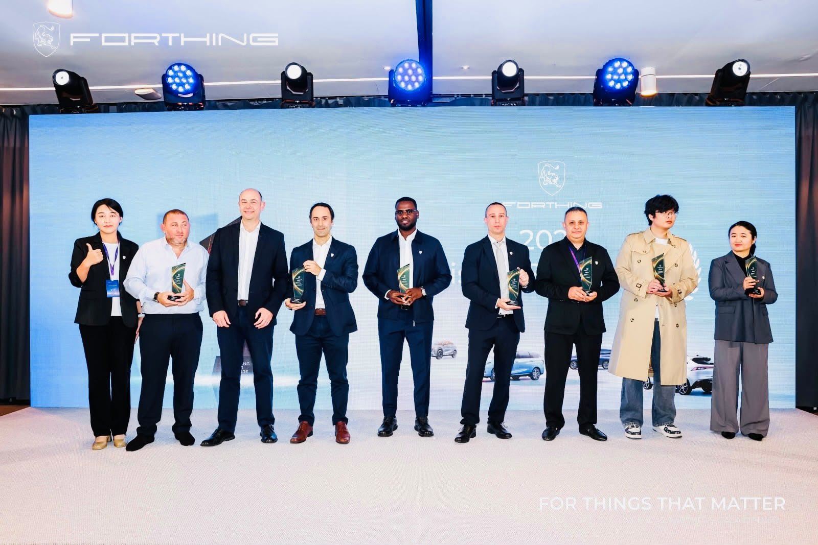 Jeeh Motors at the 2026 Paris Motor Show: Bringing FORTHING's Next Generation of Electric Mobility Closer to Ethiopia 3 Group of FORTHING distributor award recipients on stage at the 2026 Paris Motor Show