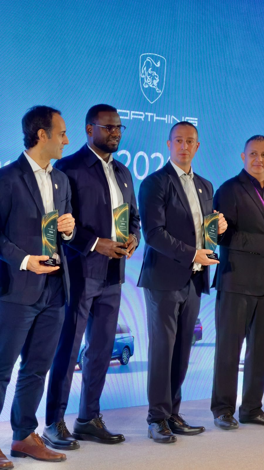 Jeeh Motors at the 2026 Paris Motor Show: Bringing FORTHING's Next Generation of Electric Mobility Closer to Ethiopia 7 Jeeh Motors CEO Mr. Mahad with fellow distributors holding awards on the FORTHING 2026 stage